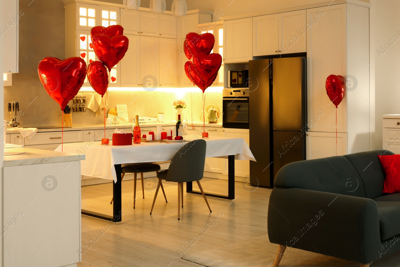 Photo of Romantic atmosphere. Cosy kitchen with set table decorated for Valentine day