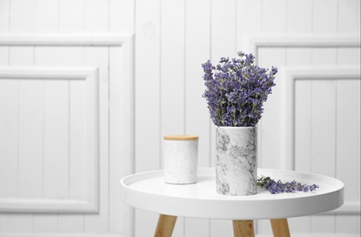 Photo of Fresh lavender flowers in vase on table against white wooden background, space for text