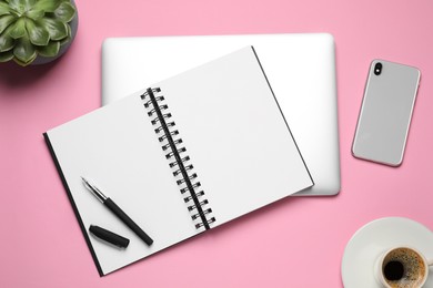 Photo of Flat lay composition with stylish notebook on pink background