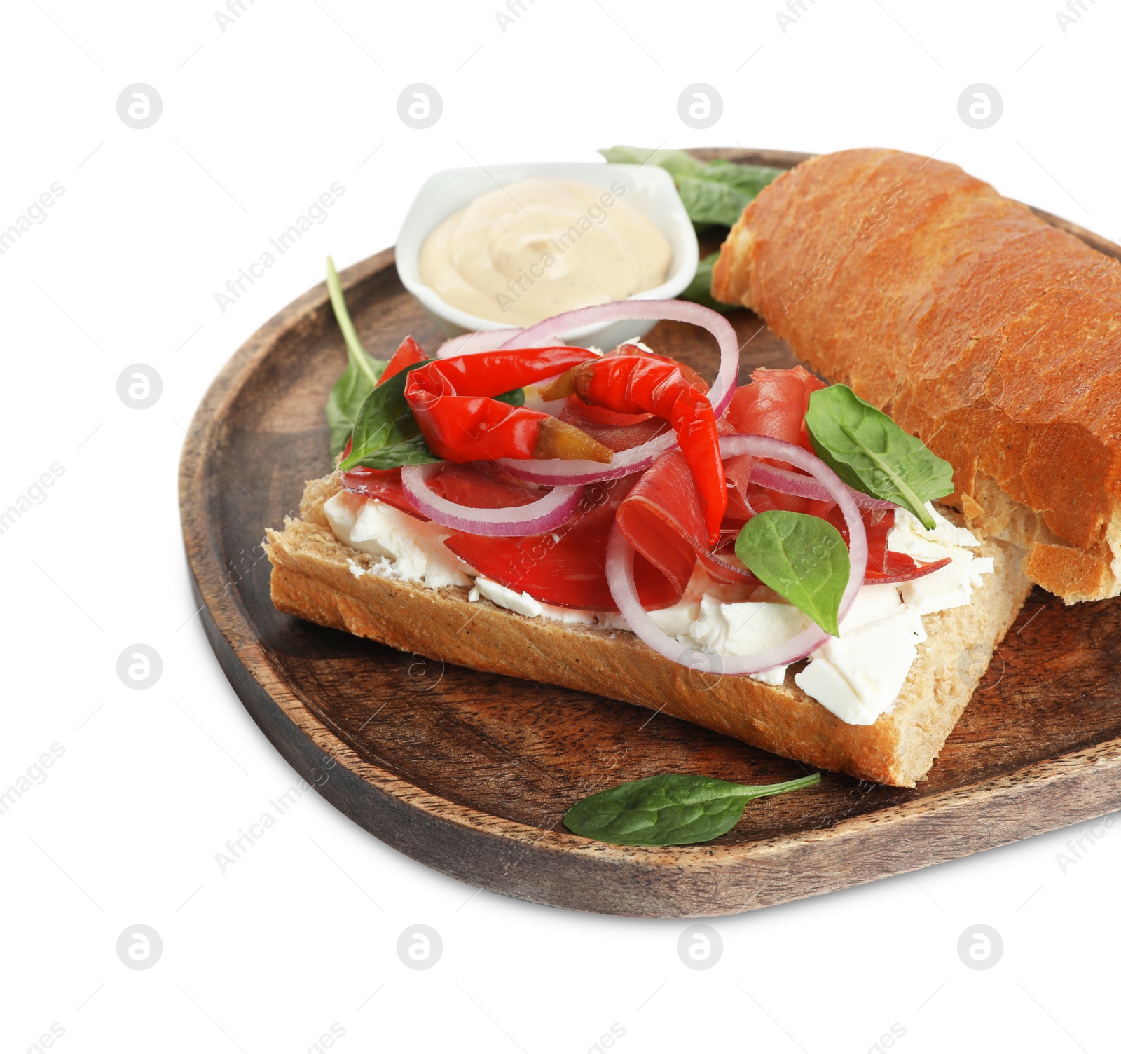 Photo of Delicious sandwich with bresaola, cream cheese, chili pepper and sauce isolated on white