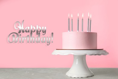 Happy Birthday! Delicious cake with burning candles on table against pink background 