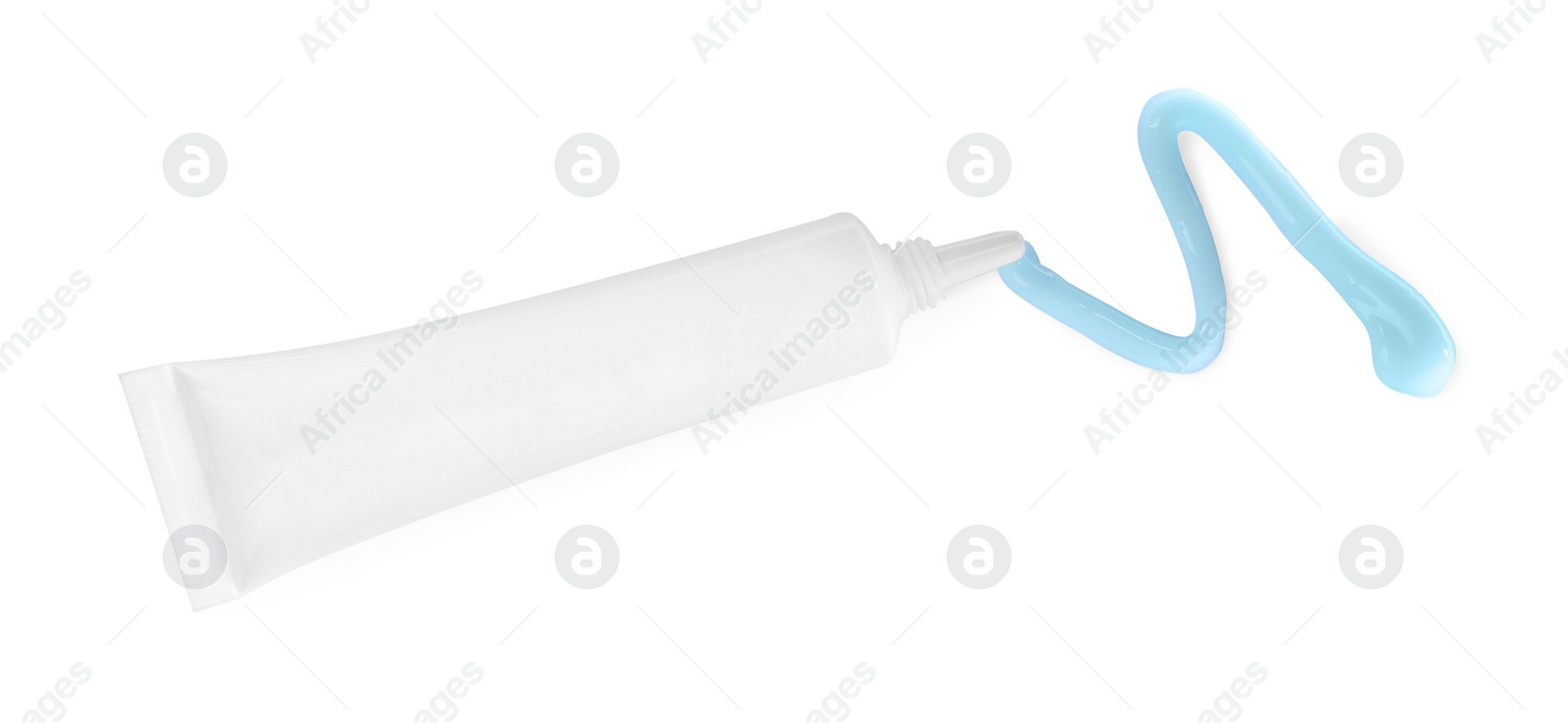 Photo of Tube with squeezed hand cream on white background, top view