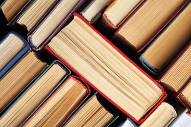 Many different hardcover books as background, top view