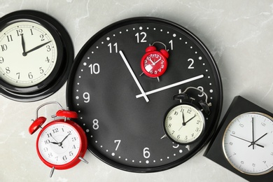 Many different clocks, top view. Time change concept