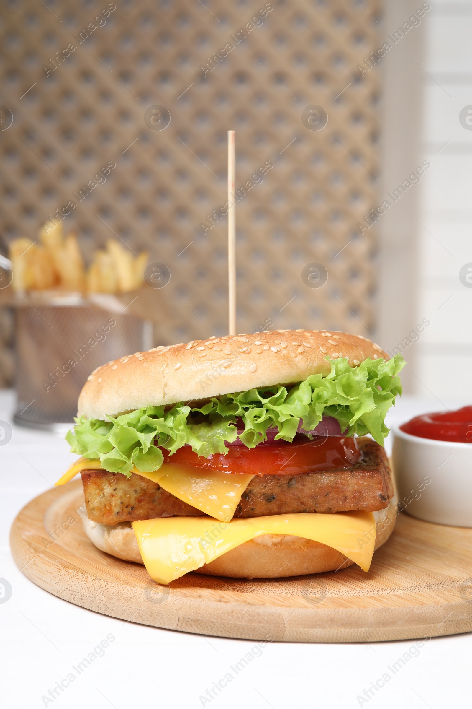 Photo of Delicious burger with tofu and fresh vegetables on white table