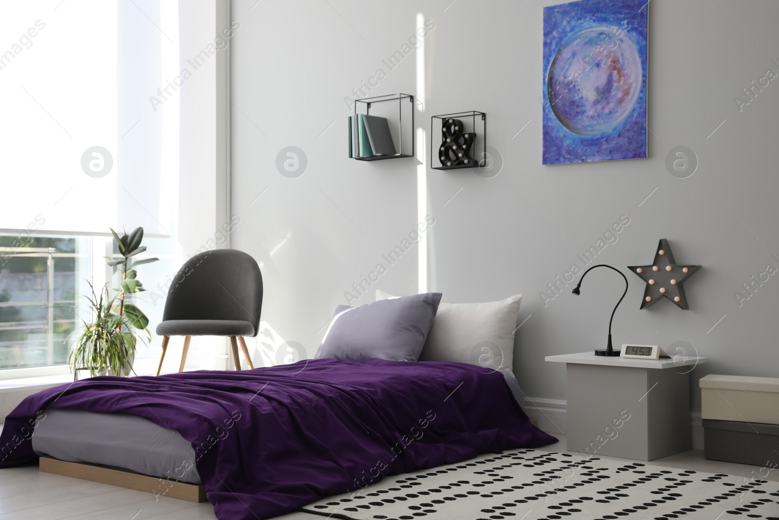 Photo of Modern teenager's room interior with comfortable bed and stylish design elements