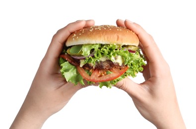 Woman holding delicious burger with beef patty and lettuce on white background, closeup