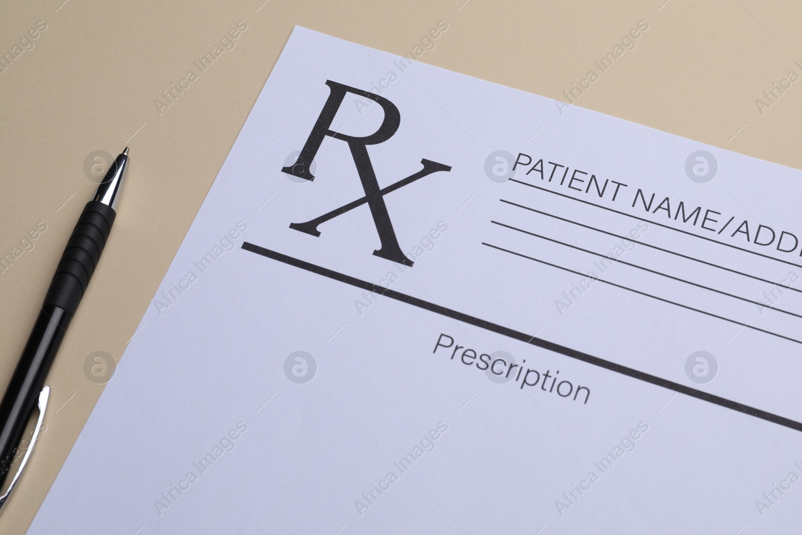 Photo of Medical prescription form and pen on beige background, closeup