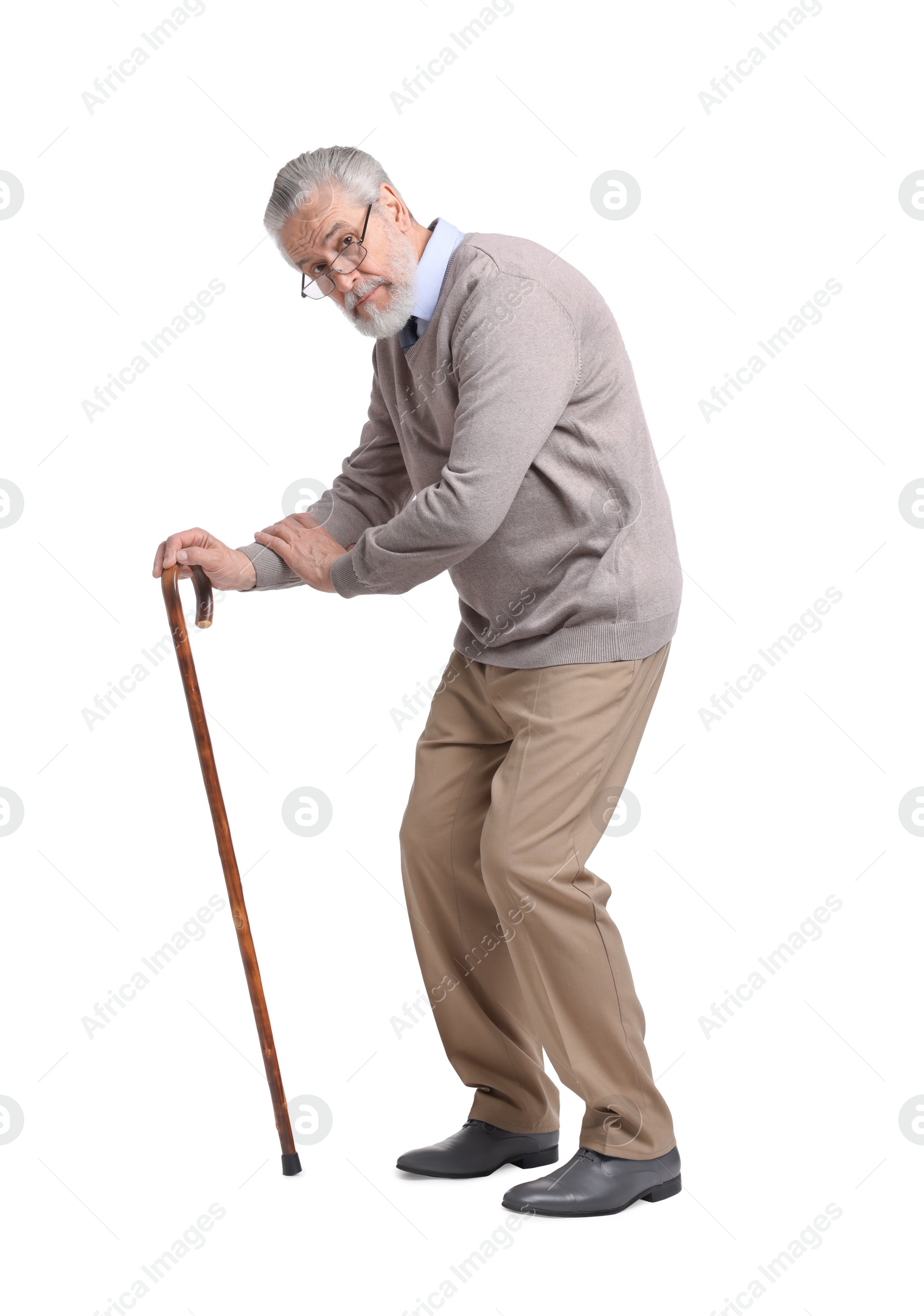 Photo of Stooped senior man with walking cane on white background