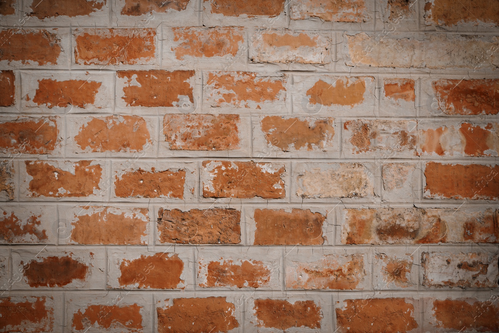 Photo of Brick wall with concrete sealing as background