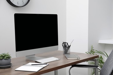 Photo of Workspace with desk and computer at home