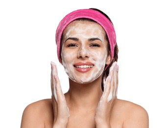 Beautiful woman applying facial cleansing foam on white background