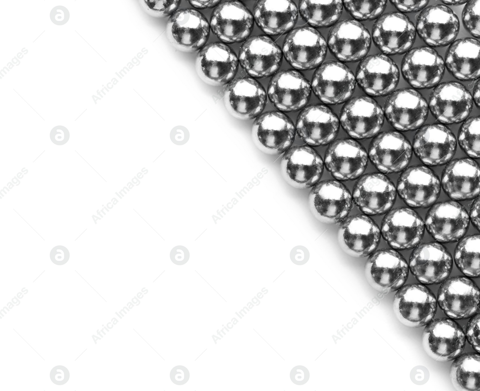 Photo of Metal magnetic balls isolated on white, top view. Space for text