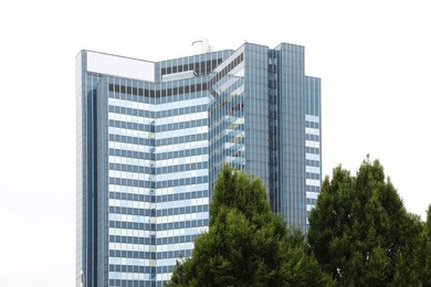 Photo of View of beautiful building and green trees outdoors