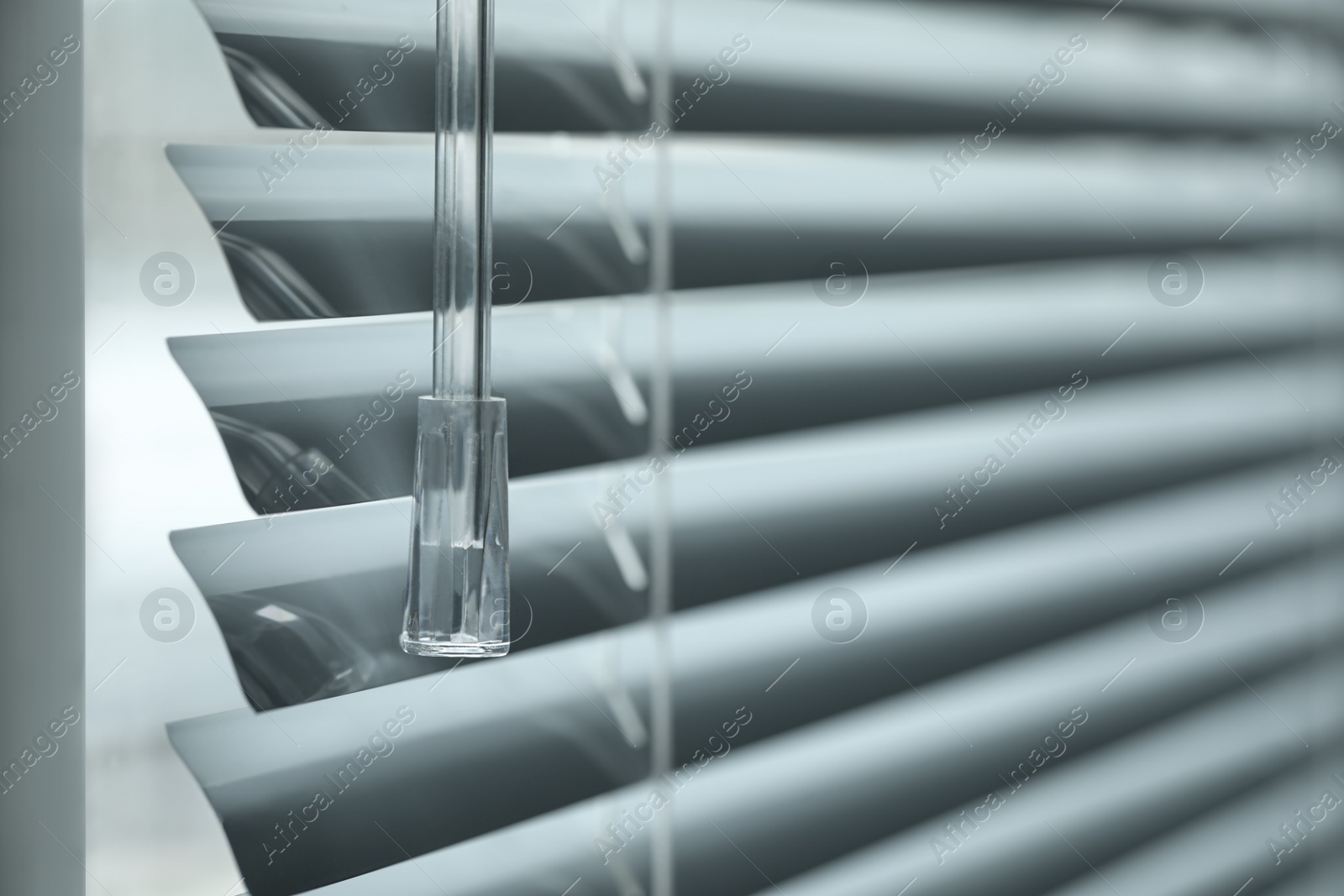 Photo of Closeup view of stylish horizontal window blinds