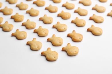 Delicious goldfish crackers on white background, closeup