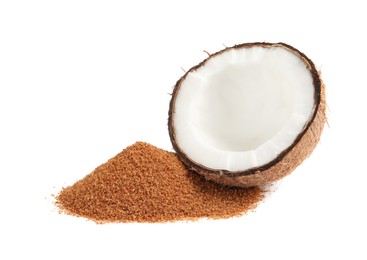 Photo of Ripe coconut and pile of brown sugar on white background