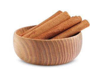 Photo of Aromatic cinnamon sticks in bowl isolated on white