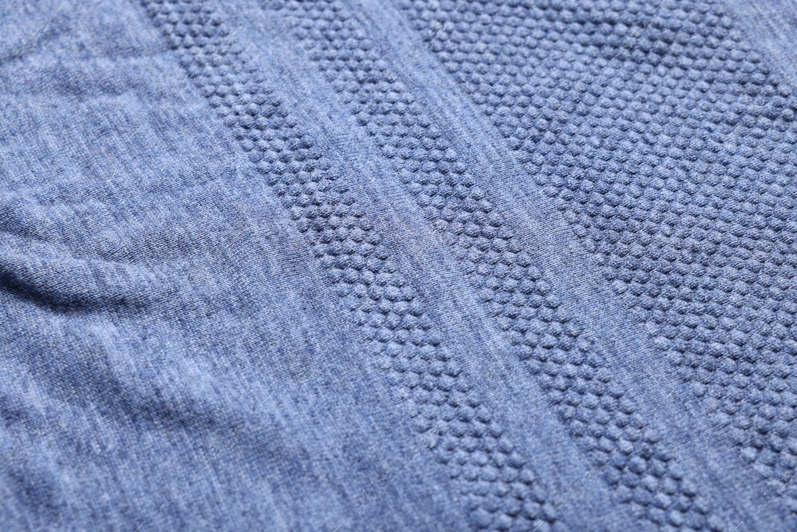 Photo of Texture of soft blue fabric as background, closeup