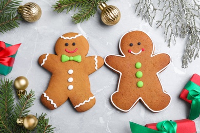 Flat lay composition with gingerbread people on light  grey marble table