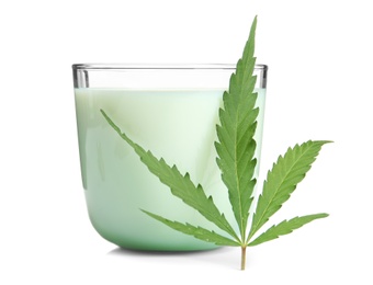 Glass with hemp milk on white background