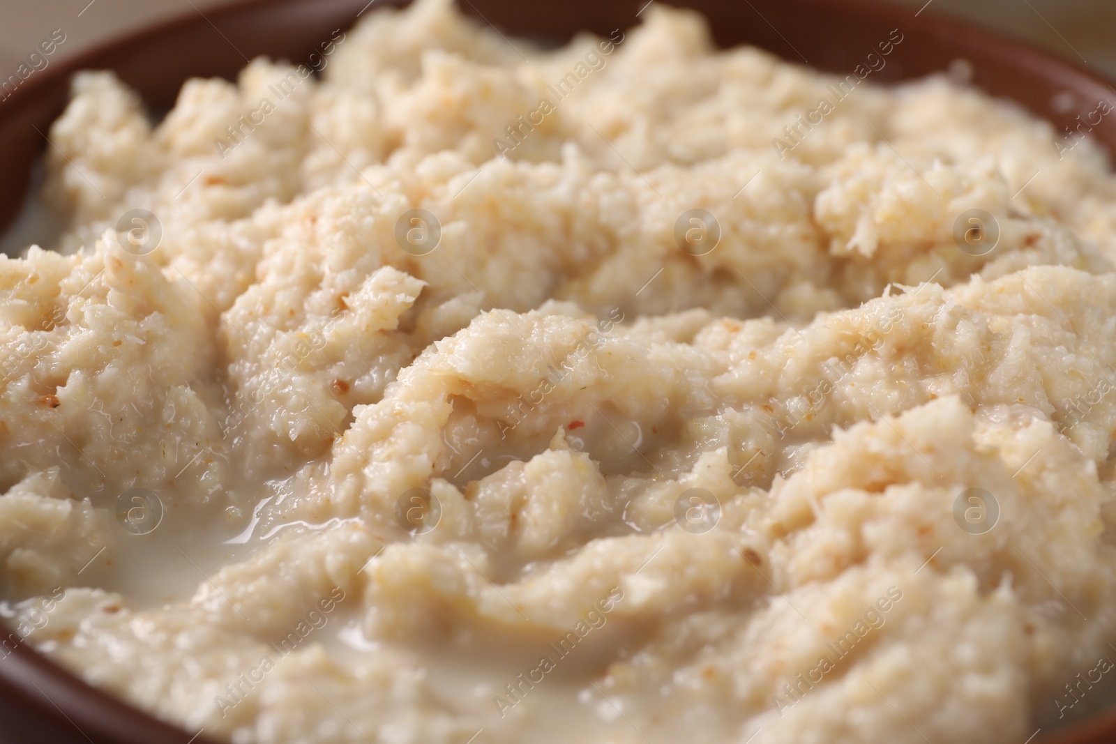 Photo of Spicy horseradish sauce in bowl, closeup view