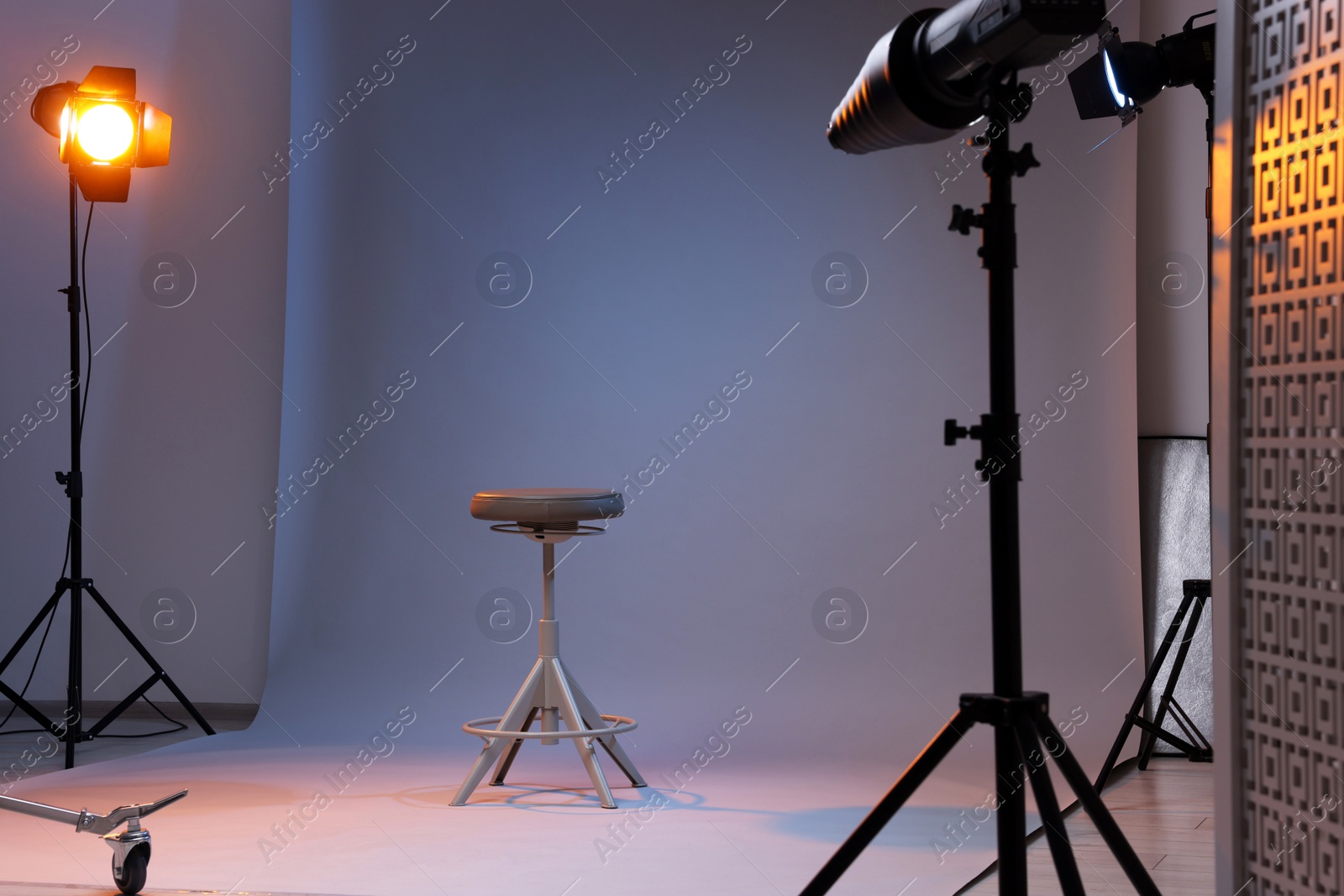 Photo of Casting call. Chair and different equipment in modern studio