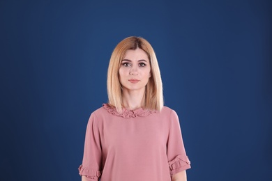 Photo of Portrait of beautiful woman on color background