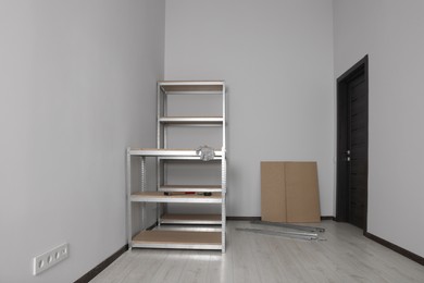 Office room with white walls and metal storage shelves