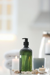 Soap dispenser and decor elements on table