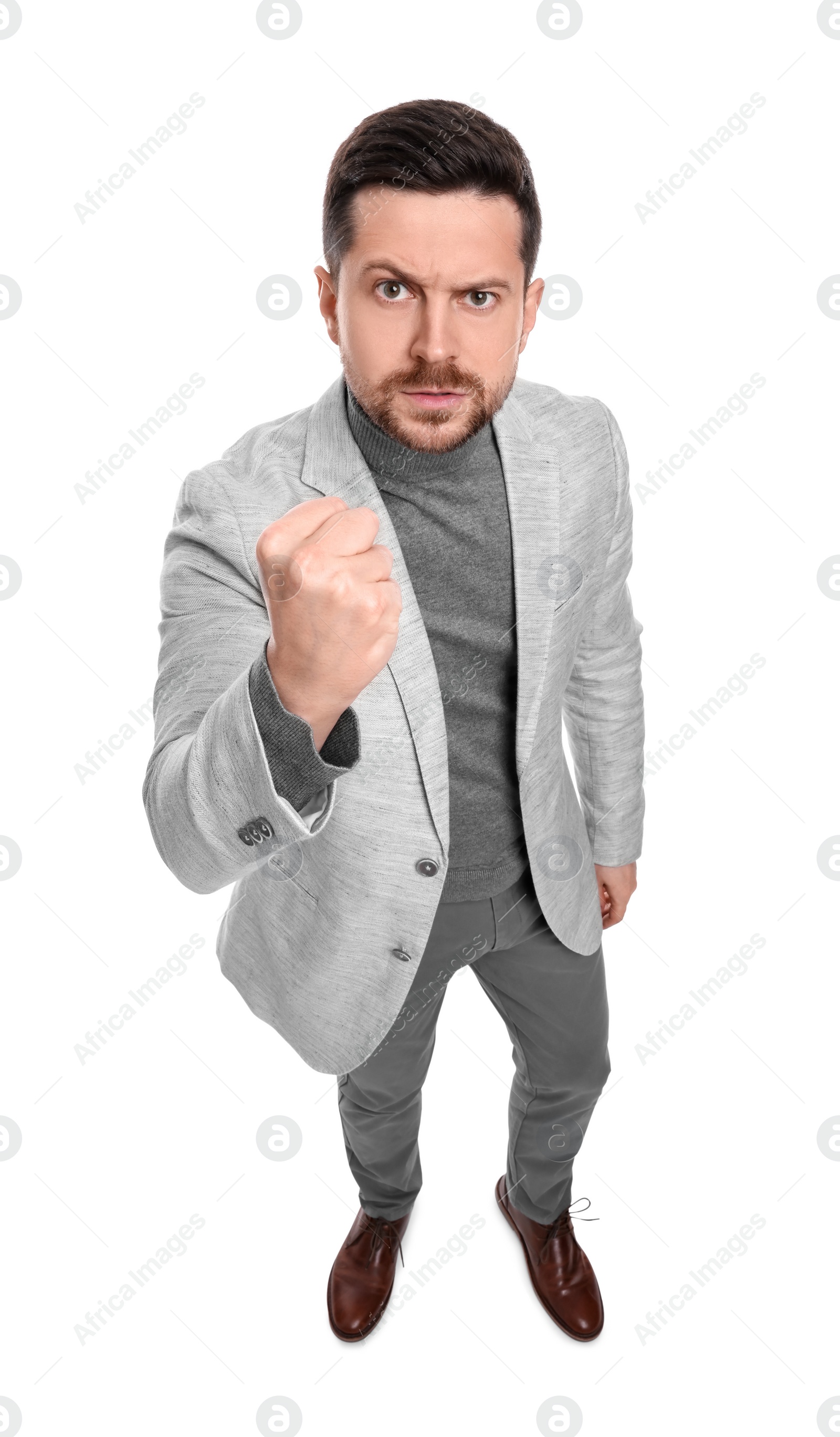 Photo of Emotional bearded businessman in suit on white background, above view