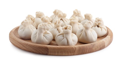 Photo of Wooden board with uncooked khinkali (dumplings) isolated on white. Georgian cuisine