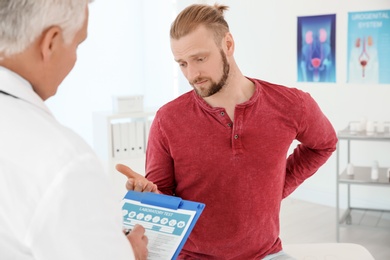 Man with health problems visiting urologist at hospital