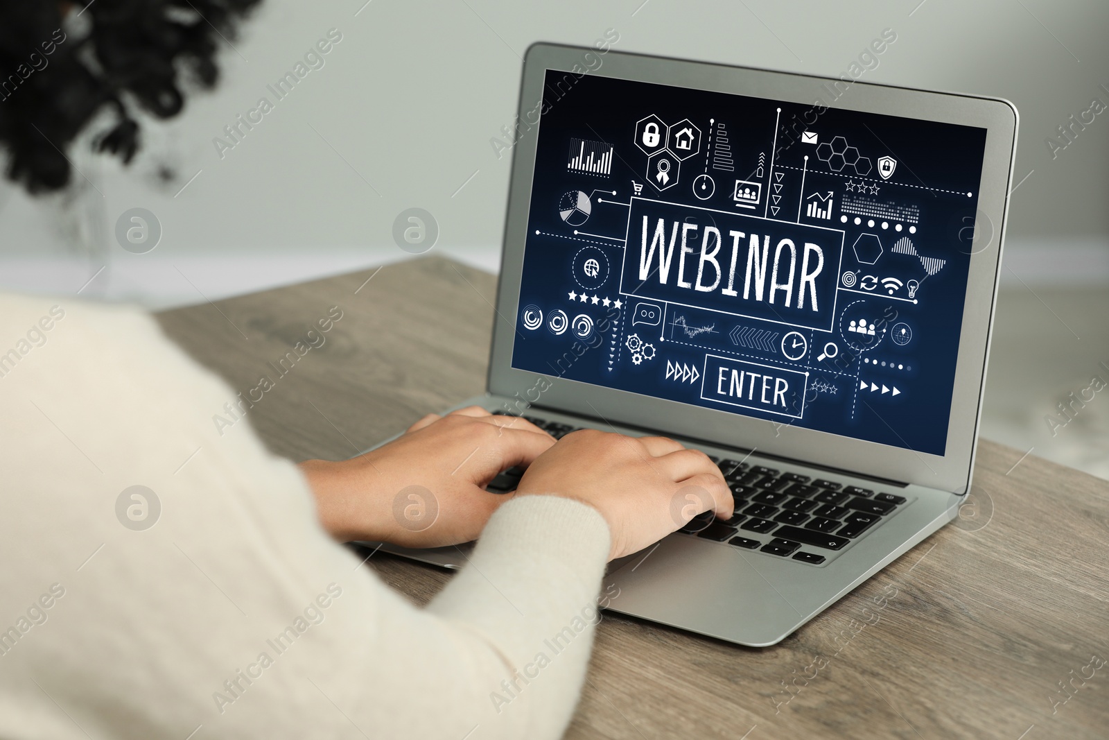 Image of Online webinar, web page on computer screen. Woman using laptop at wooden table, closeup