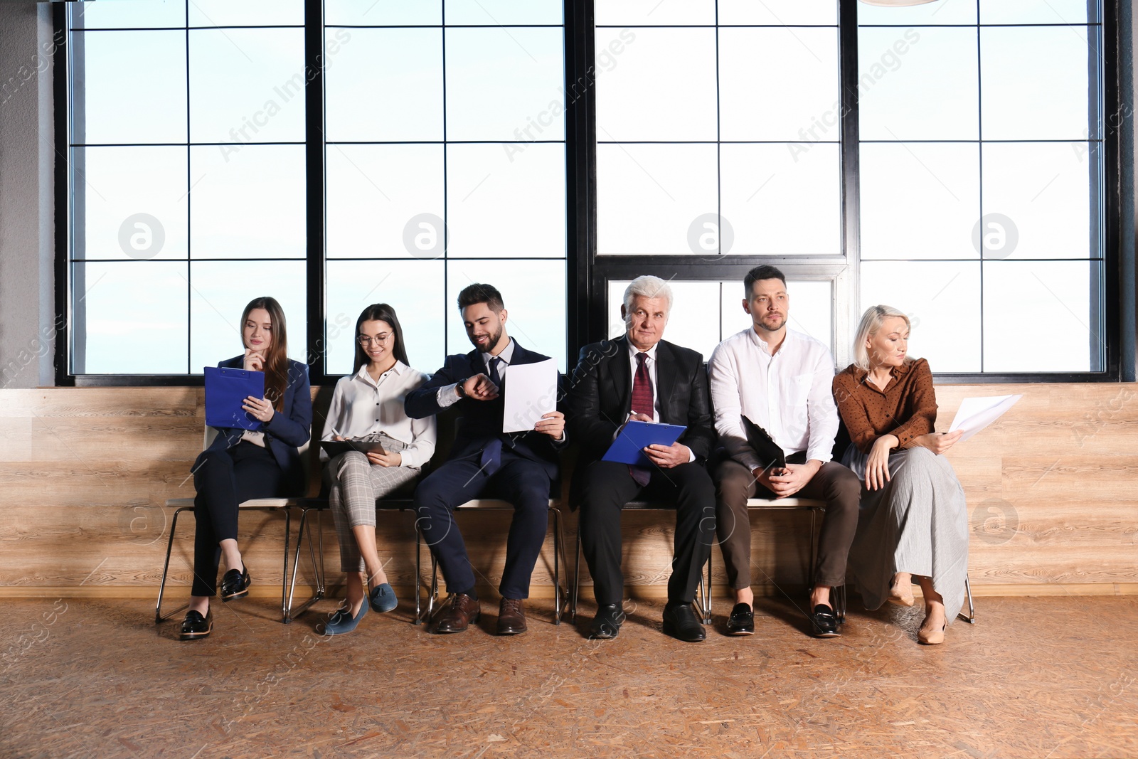 Photo of People waiting for job interview in office hall