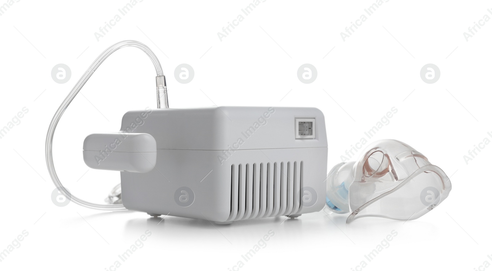 Photo of Modern nebulizer with face mask on white background. Inhalation equipment