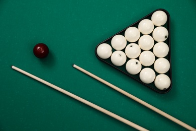 Flat lay composition with balls on billiard table