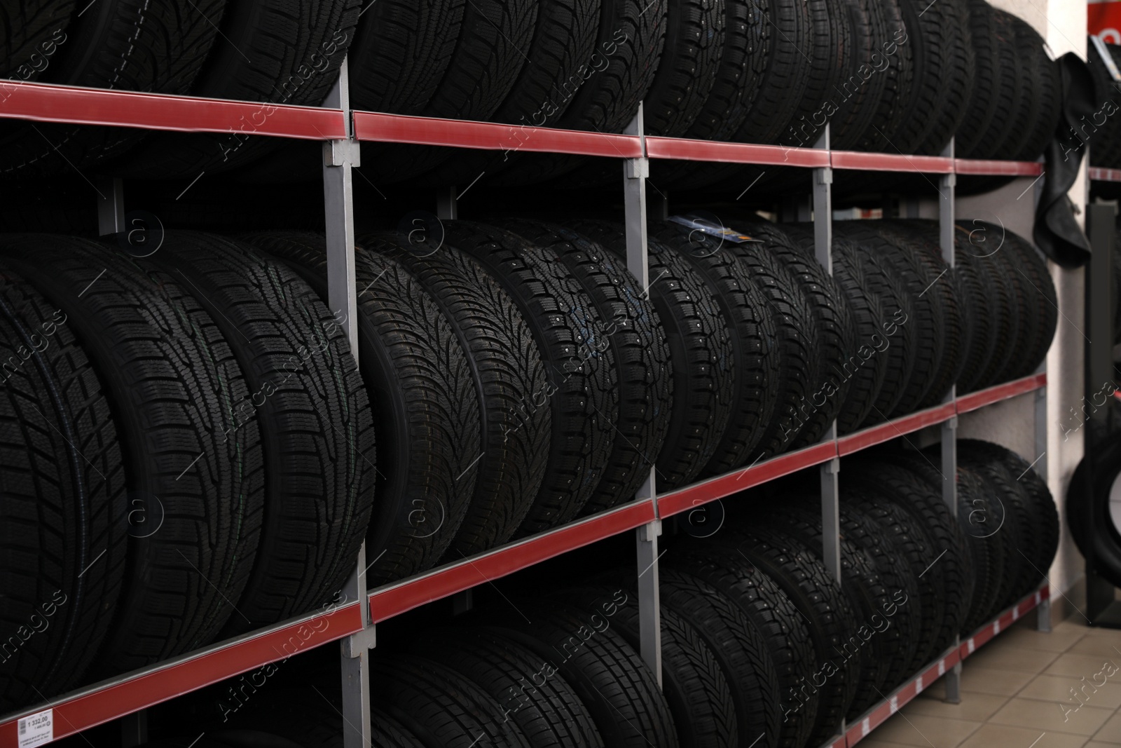 Photo of Car tires on rack in auto store