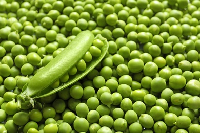 Photo of Many fresh green peas as background, closeup