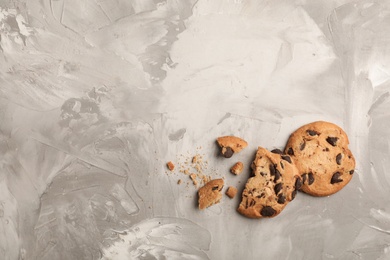 Photo of Flat lay composition with chocolate cookies and space for text on gray background