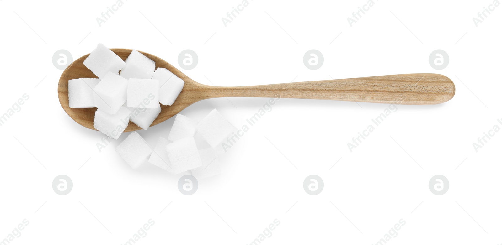 Photo of Sugar cubes and wooden spoon isolated on white, top view