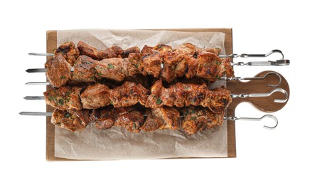 Photo of Metal skewers with delicious meat on white background, top view