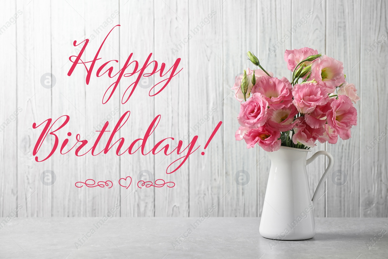 Image of Happy Birthday! Eustoma flowers in vase on white able 