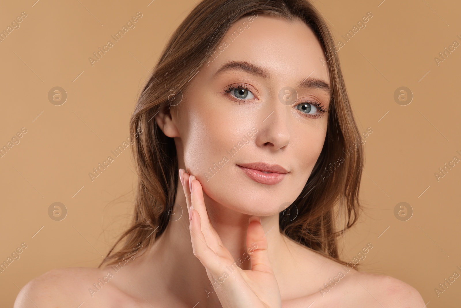 Photo of Beautiful woman with healthy skin on beige background