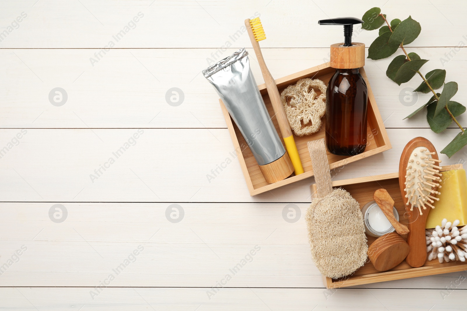 Photo of Flat lay composition with eco friendly products and space for text on white wooden table