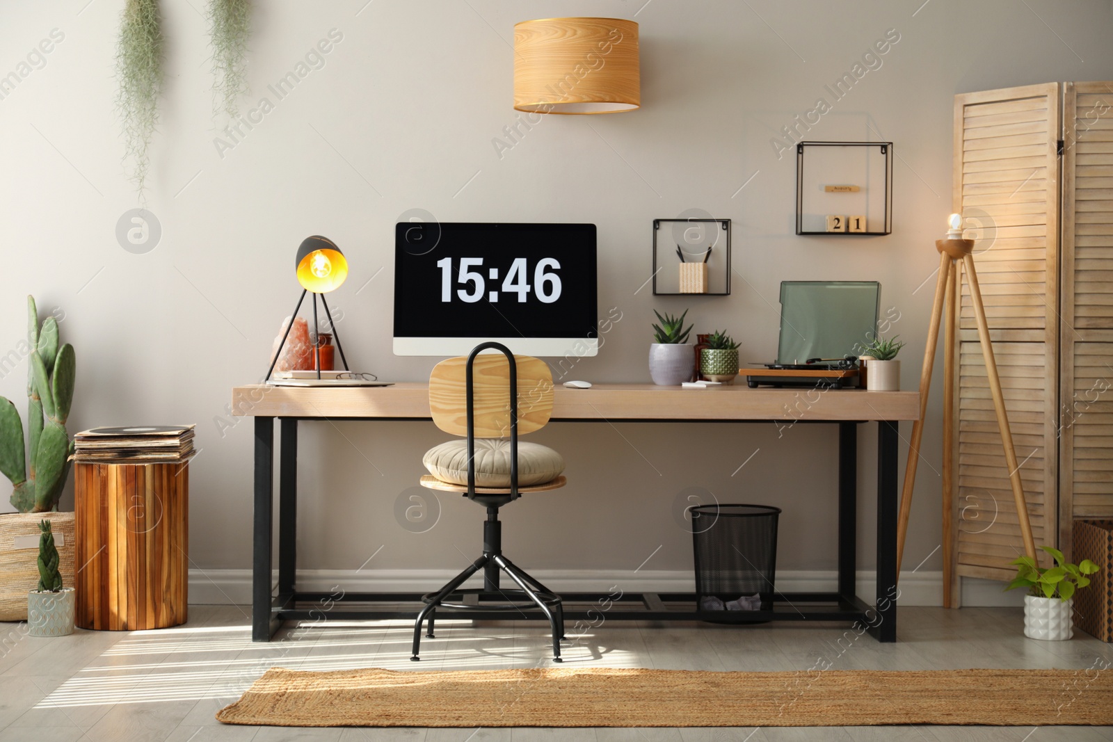 Photo of Room interior with comfortable workplace. Modern computer on wooden desk