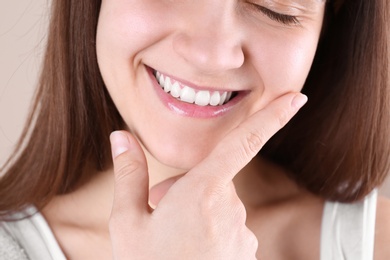 Photo of Young woman with beautiful smile, closeup view