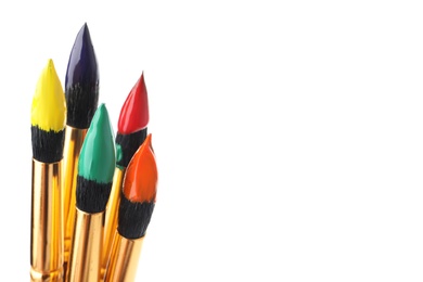 Photo of Brushes with colorful paints on white background