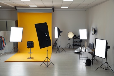 Interior of modern photo studio with professional equipment