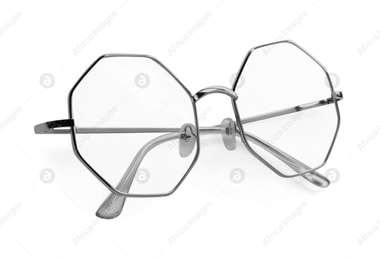 Photo of Stylish glasses with metal frame isolated on white